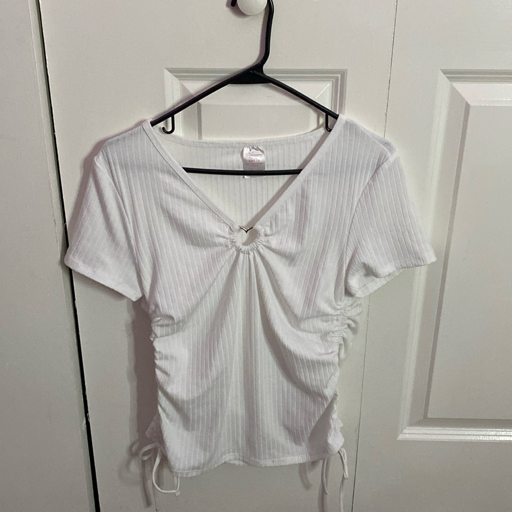 White top with heart embellishment